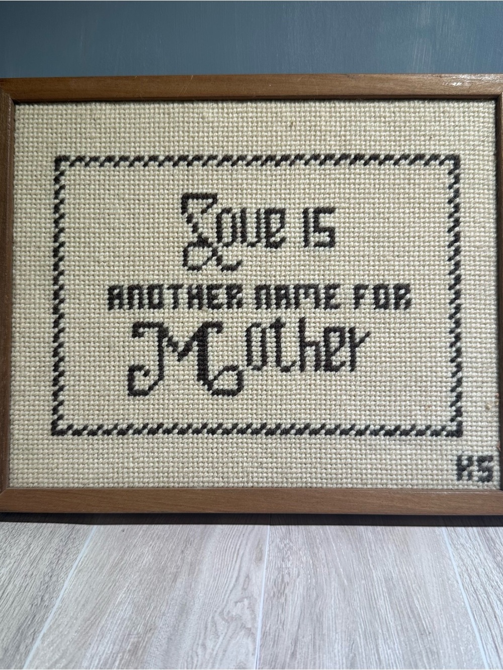 Framed Cream and Black Cross-Stitch Wall Decor - Love Is Another Name for Mother